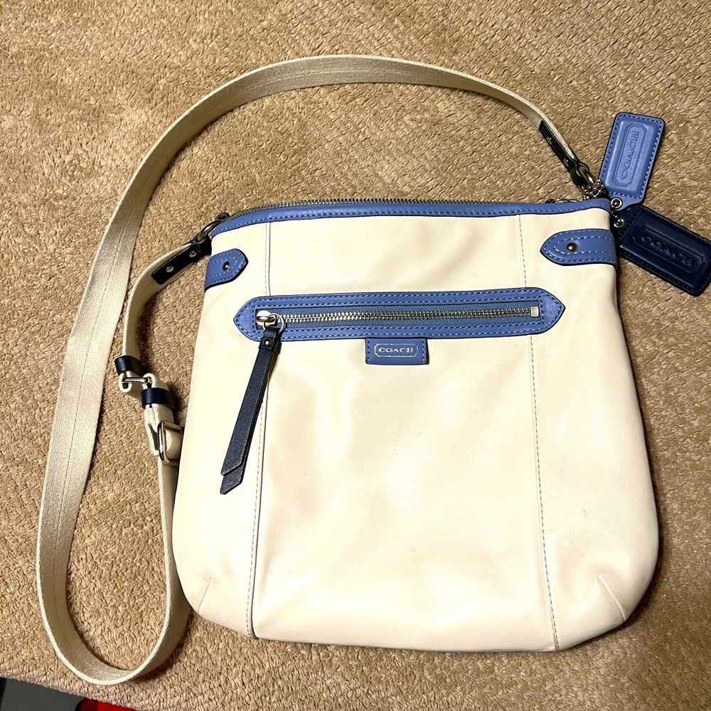 Medium sized, white and purple, beautiful Coach satchel purse.